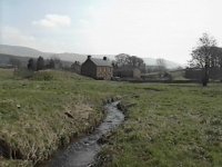 Photograph: Greenholme and one of the village green's meandering streams.